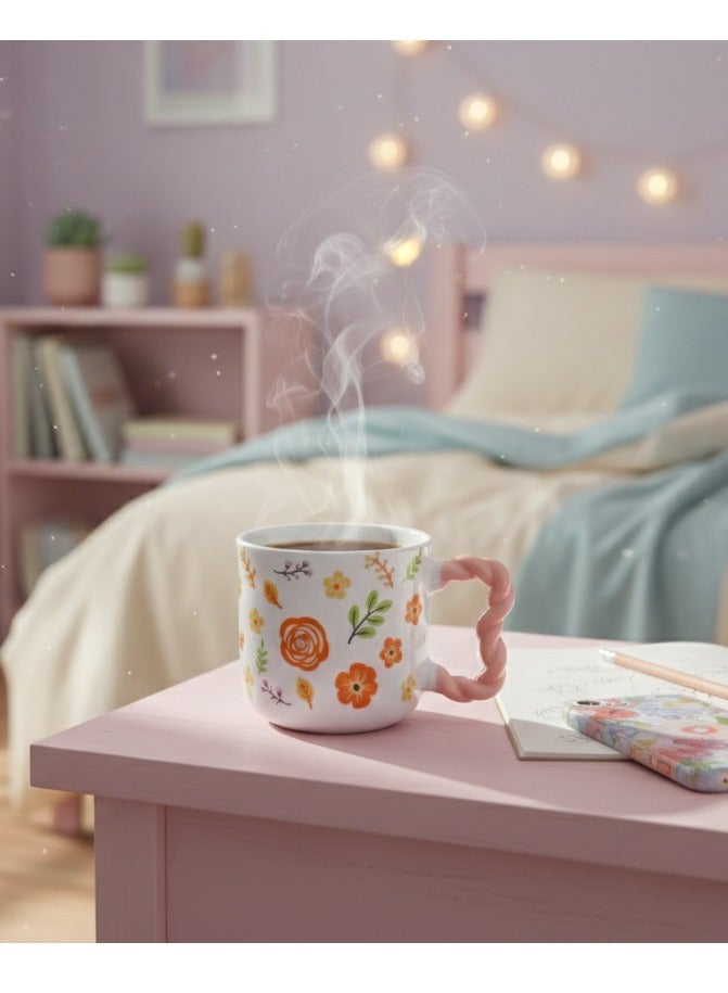 مج بورسيلين راقي سعة 380 ملي بنقوش أزهار ربيعية مبهجة وألوان برتقالية وصفراء زاهية مع يد وردية بتصميم مضلع مريح لليد - Image 2